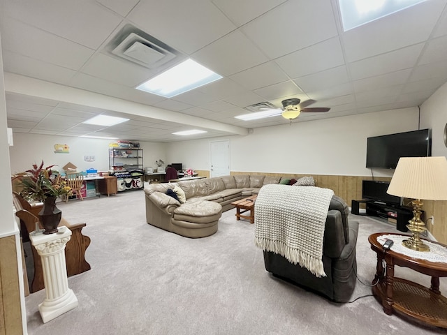 carpeted living room featuring a paneled ceiling and ceiling fan