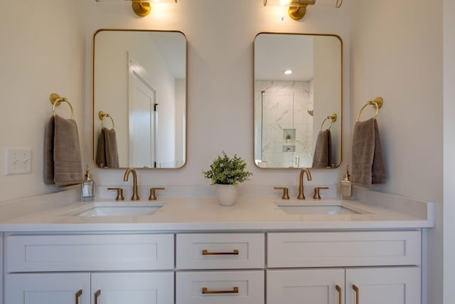 bathroom featuring vanity and an enclosed shower