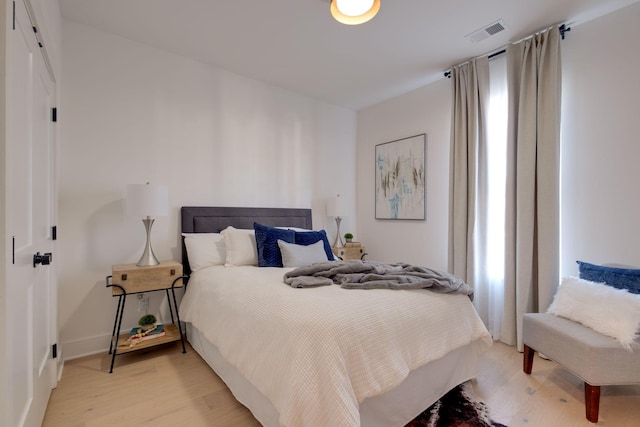 bedroom featuring light wood-type flooring