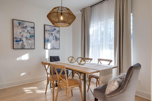 dining area with light hardwood / wood-style flooring