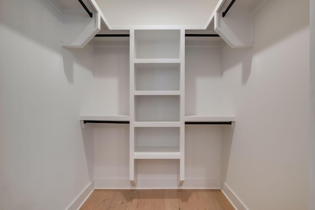 spacious closet with light hardwood / wood-style floors