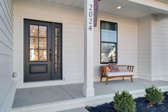 property entrance with covered porch