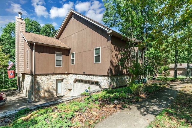 view of side of property with a garage