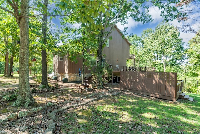 view of yard featuring a wooden deck