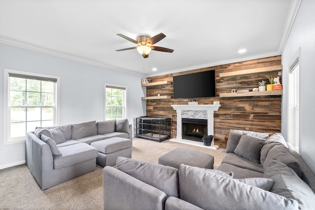 living room with crown molding, light carpet, and ceiling fan