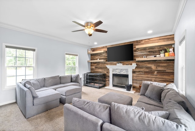 living room with ceiling fan, light carpet, and ornamental molding