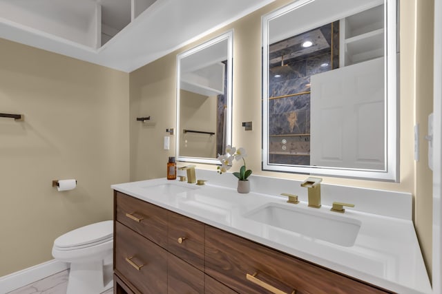 bathroom with toilet and vanity