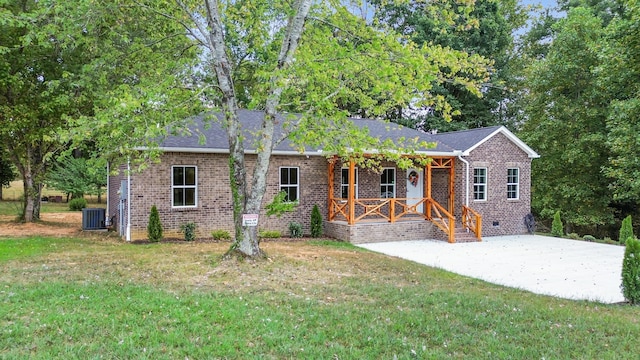 ranch-style house featuring central AC, a front yard, and a porch