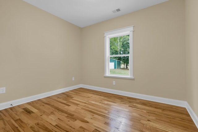 spare room featuring light hardwood / wood-style flooring