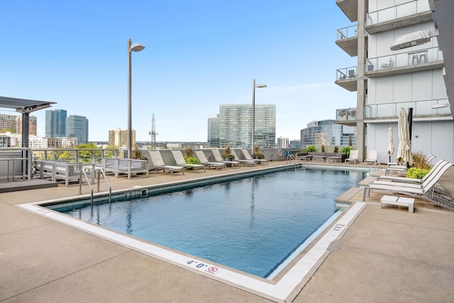 view of pool featuring a patio area