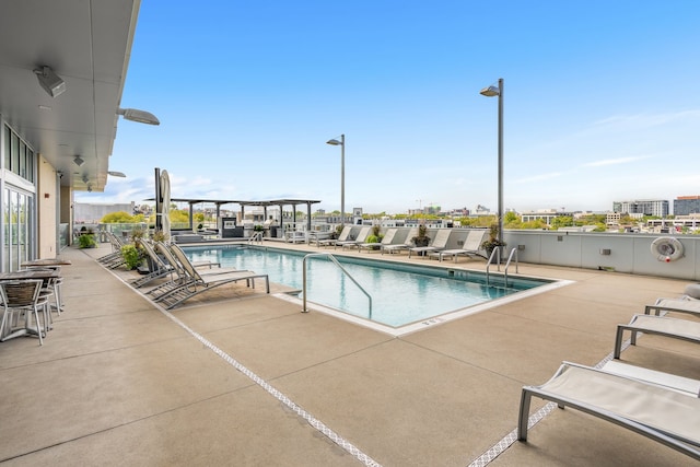 view of pool featuring a patio