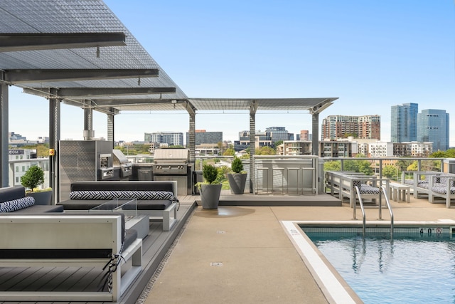 view of swimming pool featuring a bar and a patio