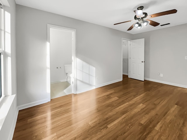 spare room with ceiling fan and hardwood / wood-style flooring