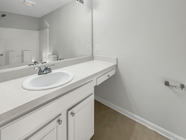 bathroom with vanity and toilet