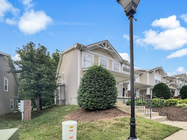 view of front of home featuring a porch and a front yard