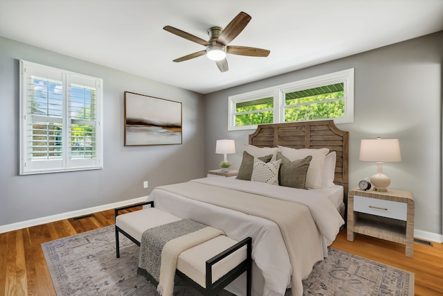 bedroom with hardwood / wood-style flooring and ceiling fan