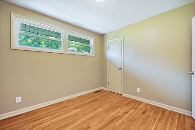 spare room featuring light hardwood / wood-style flooring