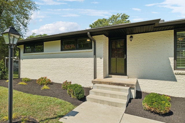 view of exterior entry featuring a porch