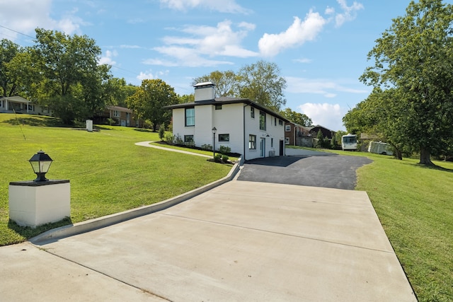 view of home's exterior with a lawn