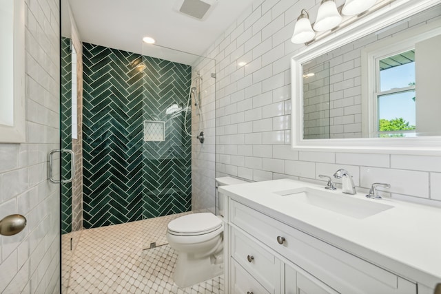 bathroom featuring tile patterned flooring, an enclosed shower, toilet, tile walls, and vanity