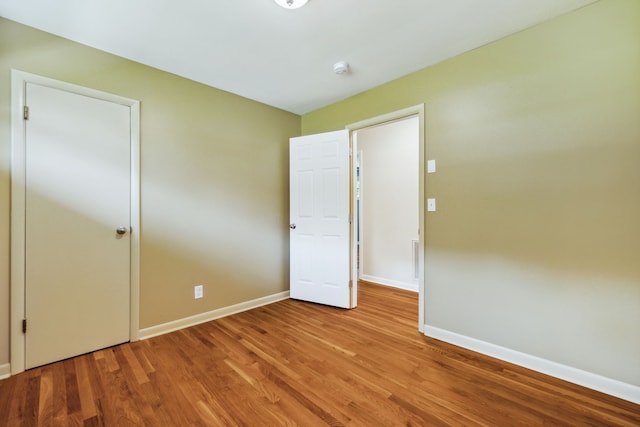 unfurnished room featuring wood-type flooring