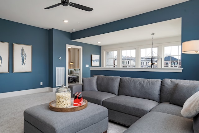 living room with carpet flooring and ceiling fan