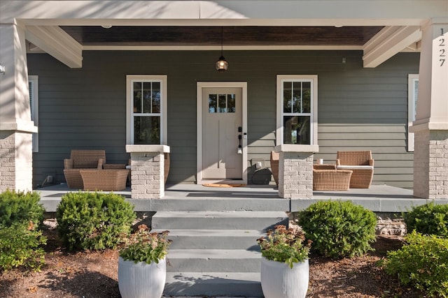 doorway to property with a porch