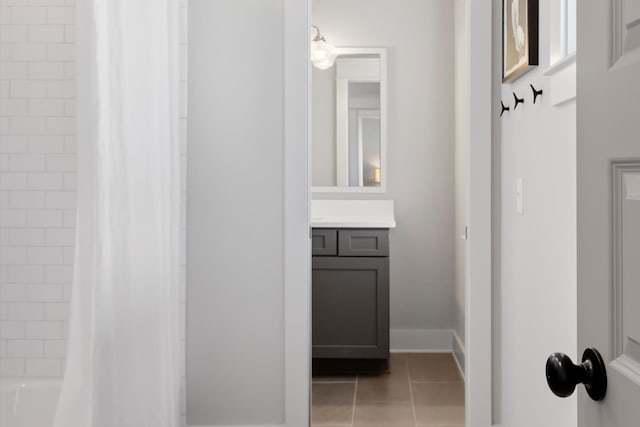 bathroom featuring shower / bath combo, tile patterned flooring, and vanity