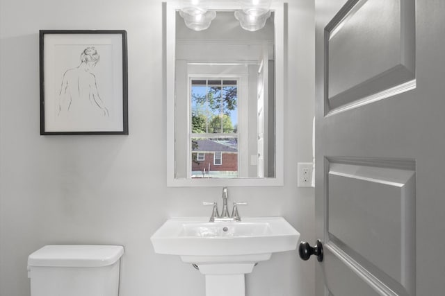 bathroom featuring sink and toilet