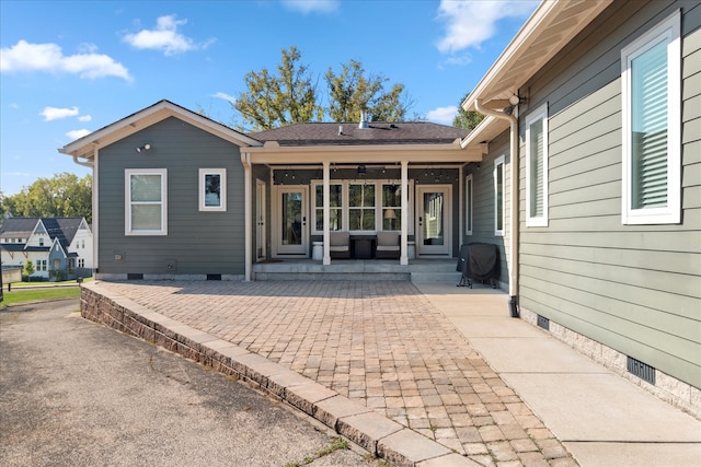 rear view of house featuring a patio, ceiling fan, and an outdoor hangout area