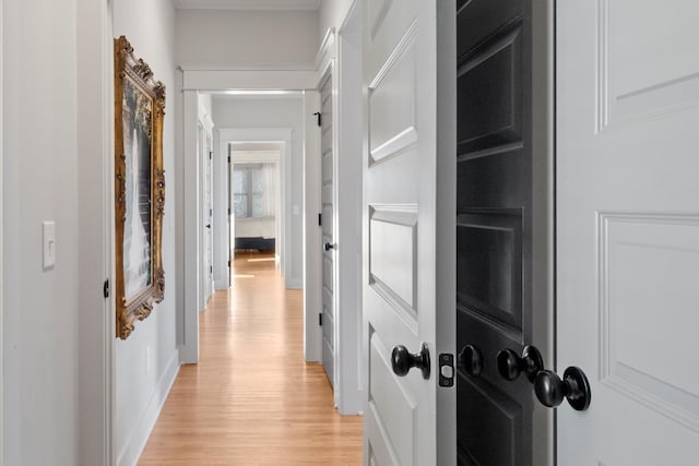 hall with light hardwood / wood-style floors