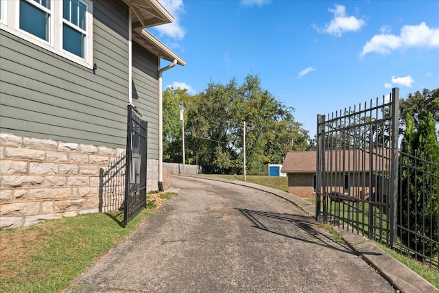 1227 Mcgavock Pike, Nashville, TN 37216 - view of asphalt driveway featuring a gated entry