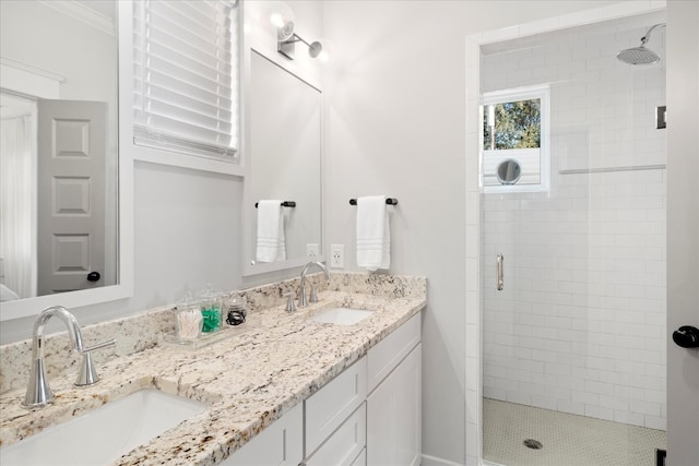 bathroom featuring walk in shower, vanity, and crown molding