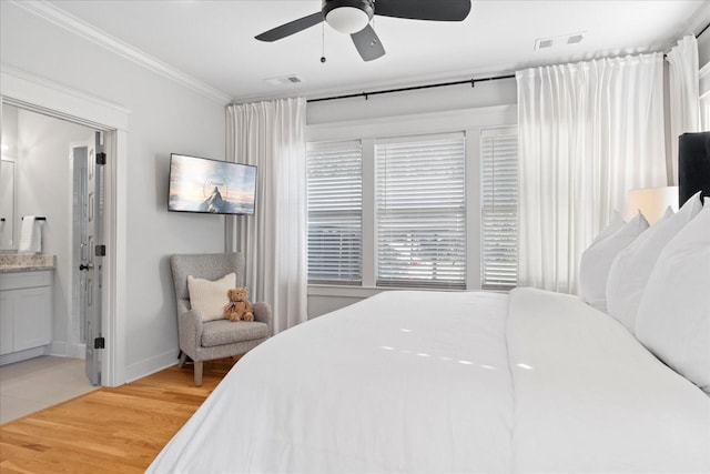1227 Mcgavock Pike, Nashville, TN 37216 - bedroom with light wood-style floors, crown molding, ensuite bathroom, and a ceiling fan
