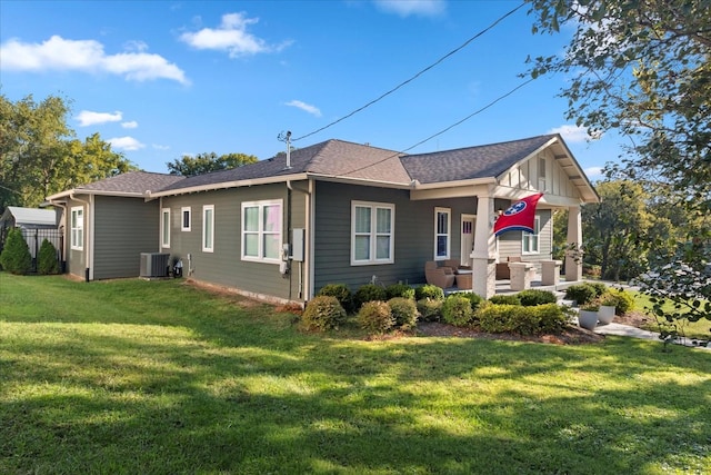 1227 Mcgavock Pike, Nashville, TN 37216 - back of property featuring a yard, central air condition unit, and a shingled roof