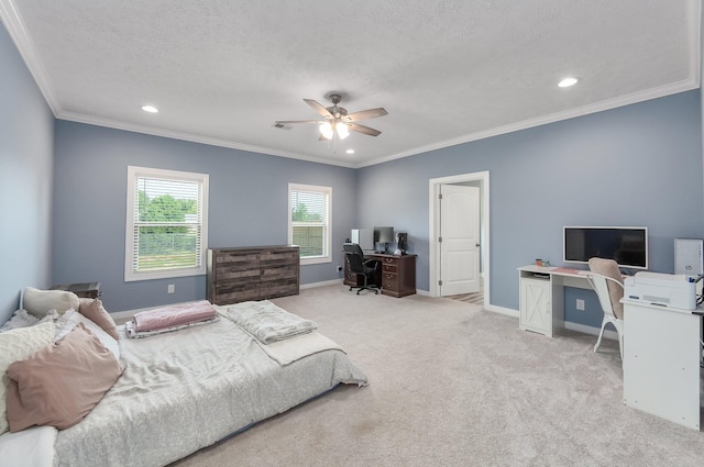 bedroom featuring light colored carpet, a textured ceiling, baseboards, and ornamental molding