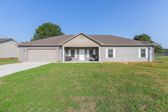 single story home with an attached garage, roof with shingles, concrete driveway, and a front yard