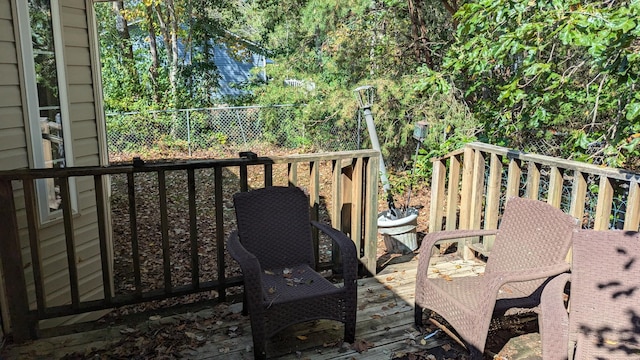 wooden deck featuring fence