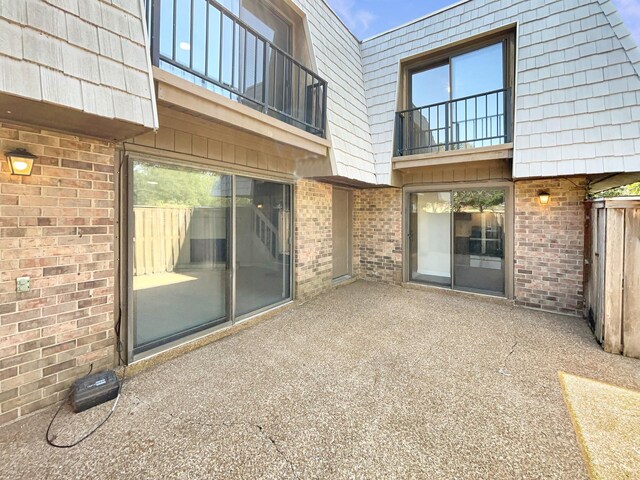 view of patio / terrace with a balcony