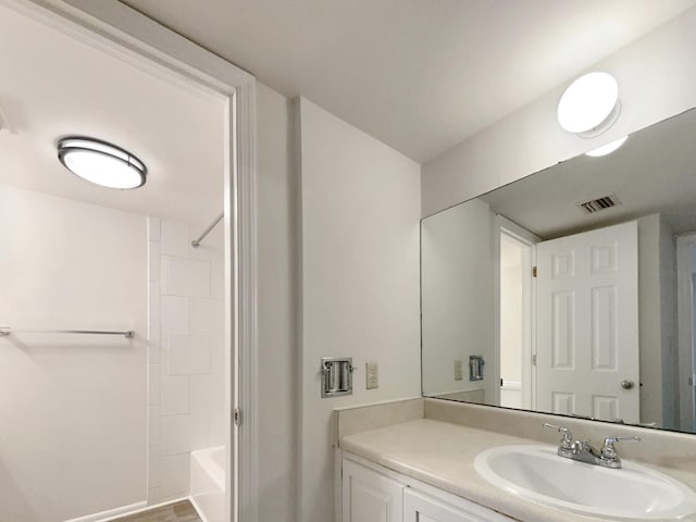 full bathroom with visible vents, bathtub / shower combination, and vanity