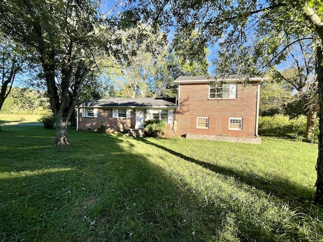 rear view of house with a lawn