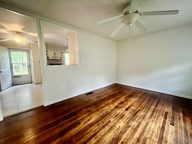 unfurnished room featuring hardwood / wood-style flooring and ceiling fan