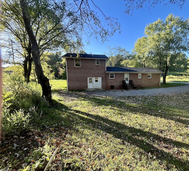 view of property exterior featuring a yard