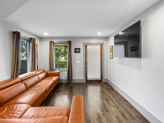 unfurnished living room featuring dark wood-type flooring