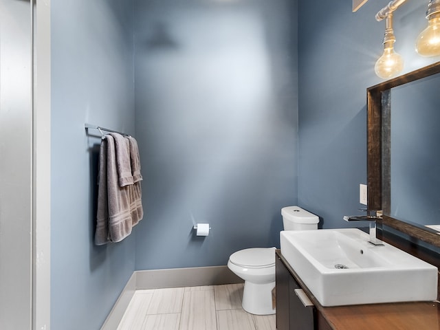 bathroom with toilet and vanity