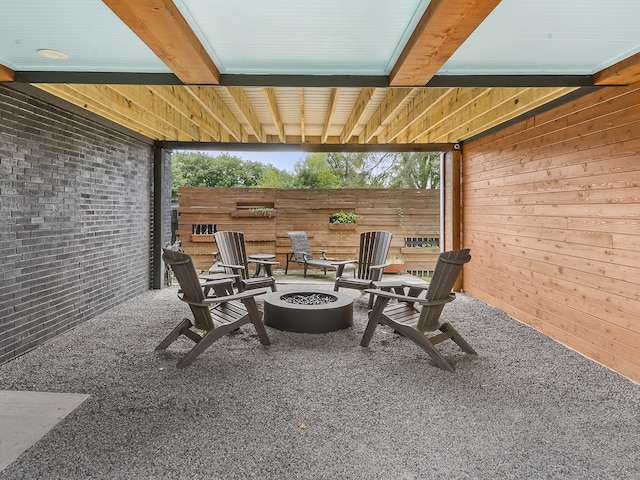 view of patio / terrace featuring an outdoor fire pit