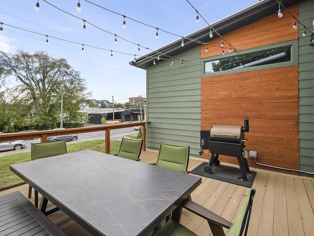 wooden terrace featuring grilling area