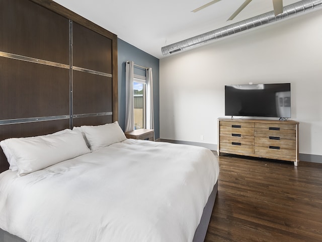 bedroom with dark wood-type flooring and ceiling fan