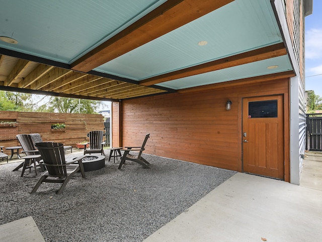 view of patio / terrace featuring an outdoor fire pit