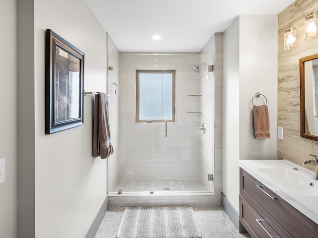 bathroom with vanity and an enclosed shower